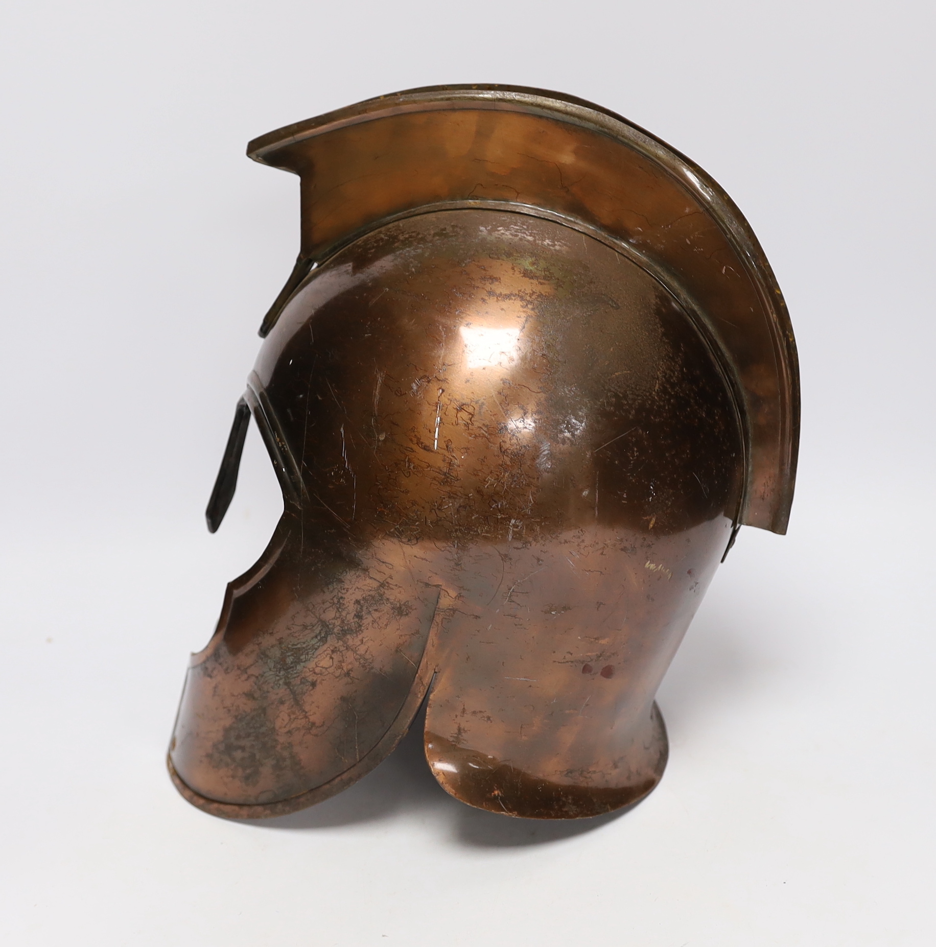 A copper gladiator's helmet, 32cm high